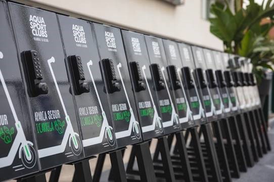 Electronic locks on e-scooter charging point